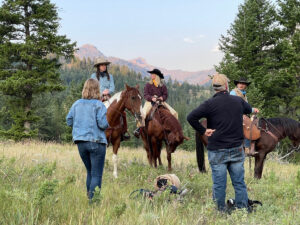 Blackwater Creek Ranch photoshoot with three riders on horses instructed by photographers.